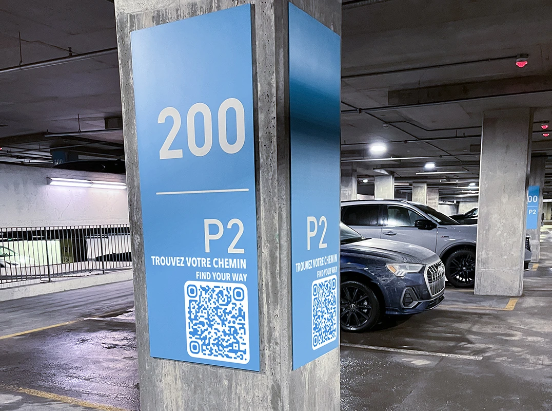 Visitor scans QR code on parking for mobile wayfinding